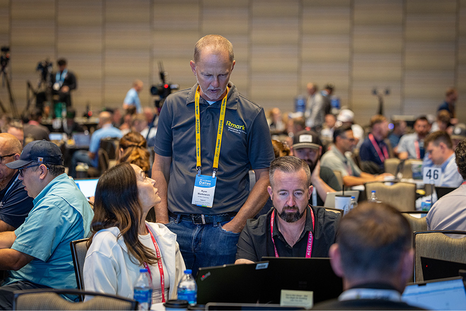 Advisors reviewing work on a laptop