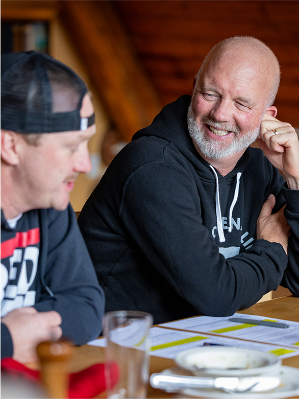 Attendees talking at retreat